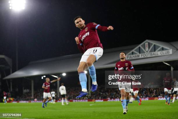 Robert Snodgrass of West Ham United celebrates after scoring his team's first goal during the Premier League match between Fulham FC and West Ham...