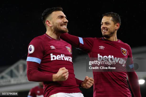 Robert Snodgrass of West Ham United celebrates after scoring his team's first goal during the Premier League match between Fulham FC and West Ham...