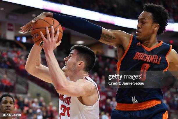 Paul Newman of the Bucknell Bisons defends against a shot attempt by Kyle Young of the Ohio State Buckeyes in the first half on December 15, 2018 at...