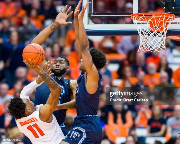 Oshae Brissett of the Syracuse Orange shoots the ball as he is fouled by Jason Wade of the Old Dominion Monarchs during the first half at the Carrier...
