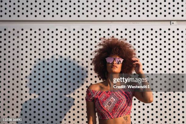 portrait of fashionable woman wearing mirrored sunglasses - fashion attitude stock pictures, royalty-free photos & images