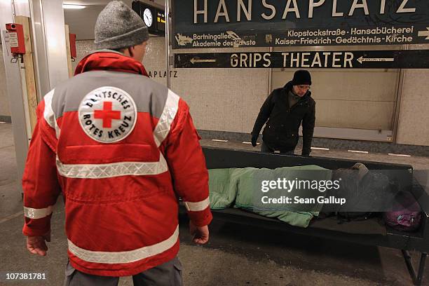 Jörg Ryll German Red Cross workers Jens Ryll and Joerg Hemmen check on homeless ...