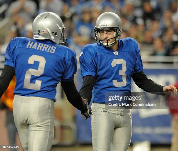 Dave Rayner of the Detroit Lions gets a handshake from teammate Nick Harris after kicking a field goal against the New England Patriots during the...