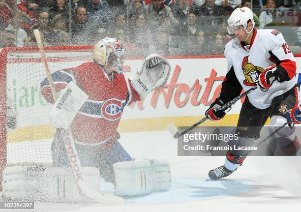 Jason Spezza of the Ottawa Senators looks for a loose puck in front of goalie Carey Price of the Montreal Canadiens during the NHL game on December...