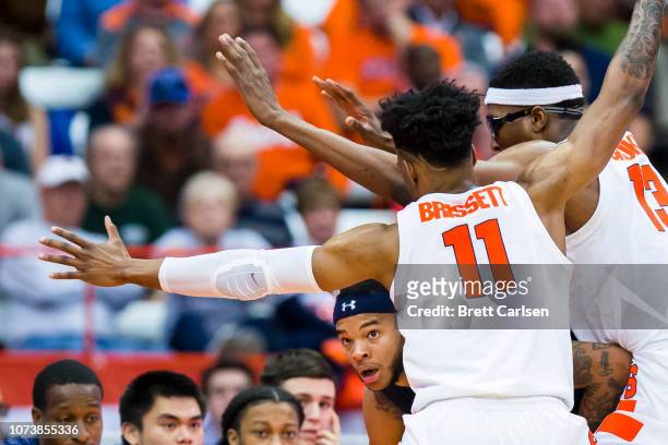 Stith of the Old Dominion Monarchs is trapped in the corner by Oshae Brissett and Paschal Chukwu of the Syracuse Orange during the second half at the...