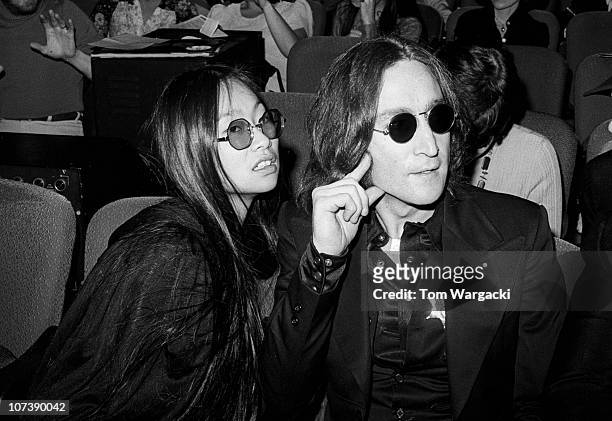John Lennon and girlfriend May Pang at the Beacon Theatre for SGT. Peppers Lonely Hearts Club Band on November 17, 1974 in New York, United States.