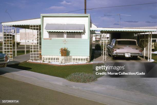 View of a Mayflower Pilgrim brand mobile home at the Apache Wells Country Club, located in the Phoenix suburb of Mesa, Arizona, June, 1963. The...