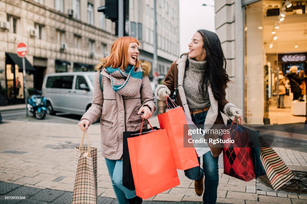 Girls carrying shopping bags