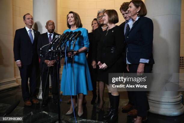 House Minority Leader Rep. Nancy Pelosi speaks to members of the media as Rep. Adam Schiff , Rep. John Lewis , Rep.-elect Veronica Escobar , Rep....