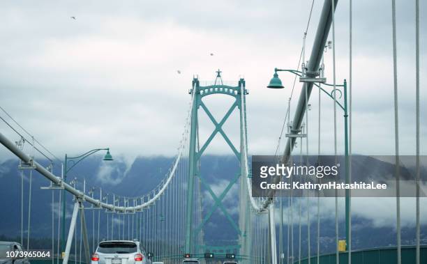 lions gate bridge to vancouver's north shore - vancouver lions gate stock pictures, royalty-free photos & images