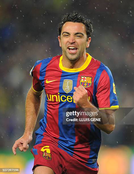 Barcelona's midfielder Xavi Hernandez celebrates after scoring against Real Madrid during the Spanish league "clasico" football match FC Barcelona vs...