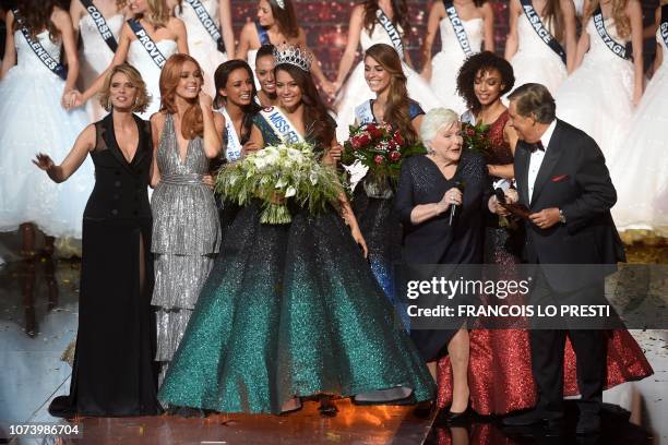 Newly elected Miss France 2019, Miss Tahiti Vaimalama Chaves poses on stage with the runners-up, Miss France Organisation Director and Miss France...