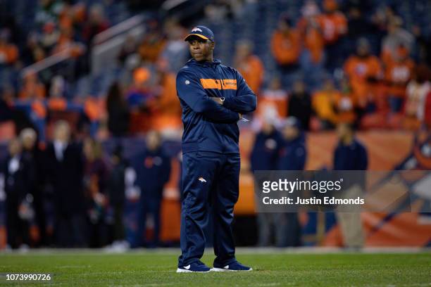 Head coach Vance Joseph of the Denver Broncos stands on the field before a game against the Cleveland Browns at Broncos Stadium at Mile High on...