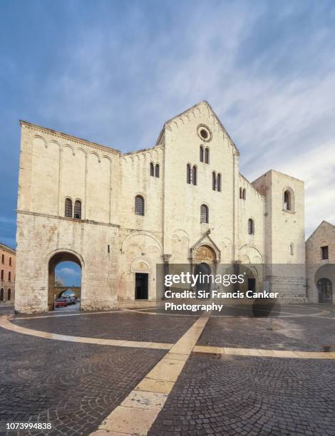 facade of basilica di san nicola in romanesque norman style in bari, apulia, italy - basilica di san nicola bari - fotografias e filmes do acervo