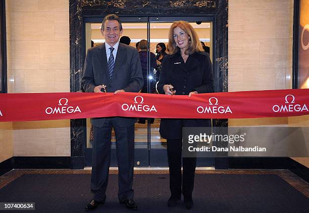 President Stephen Urquhart and Seattle Art Museum Vice Director Maryann Jordan cut the ribbon at the opening party at OMEGA Boutique on December 7,...
