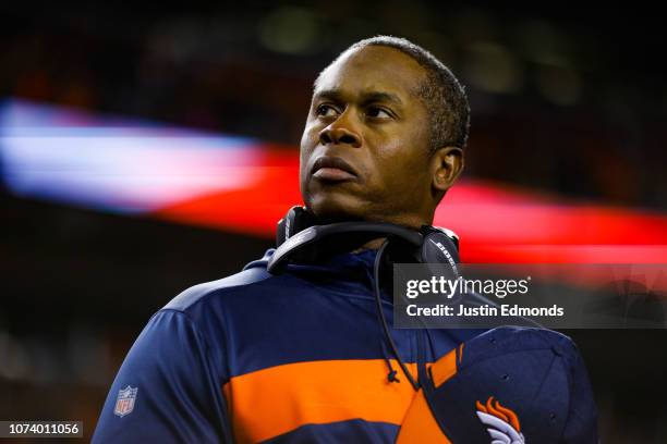 Head coach Vance Joseph of the Denver Broncos stands not he field during the national anthem before a game against the Cleveland Browns at Broncos...