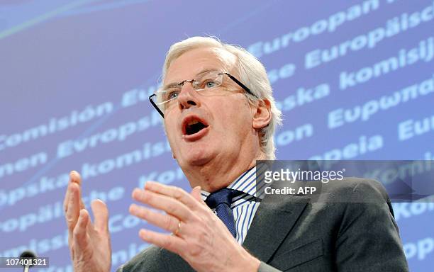 European Union Commissioner for Internal Market and Services Michel Barnier gestures while talking to the media during a press conference at the EU...