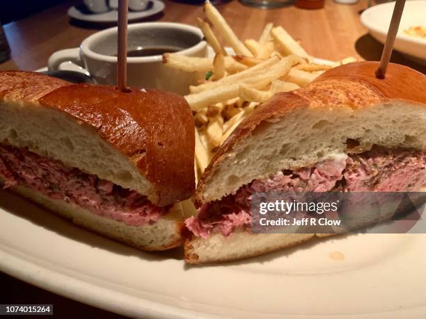 shaved prime rib sandwivh and fries - shaved steak stock pictures, royalty-free photos & images