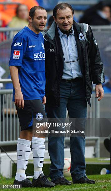 Head coach Ewald Lienen and Oliver Neuville of Bielefeld look on during the Second Bundesliga match between Arminia Bielefeld and VfL Osnabrueck at...