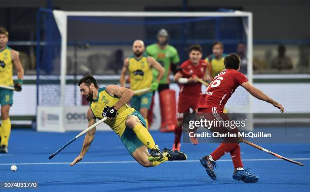 Trent Mitton of Australia is tackled by Adam Dixon of England during the FIH Men's Hockey World Cup Third place play-off match between England and...