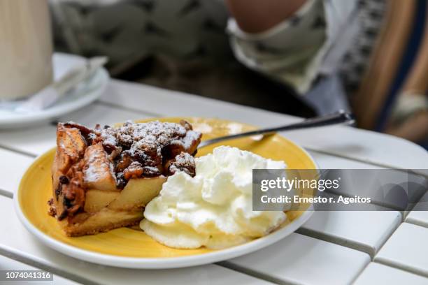 appeltaart (apple pie) served in a plate with whipped cream - appeltaart stock-fotos und bilder