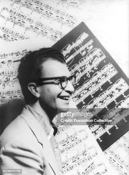 Portrait of Dave Brubeck with sheet music as backdrop