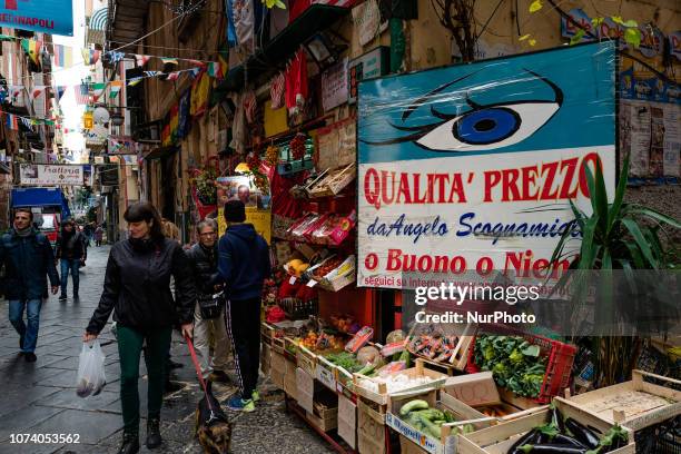 Walk through the streets of Naples from San Gregorio Armeno to the Quartieri Spagnoli, to the Vomero, on 15 December 2018 to the fish market, to the...