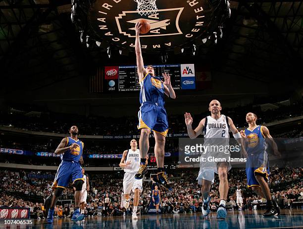 David Lee of the Golden State Warriors goes in for the layup against Jason Kidd of the Dallas Mavericks during a game on December 7, 2010 at the...