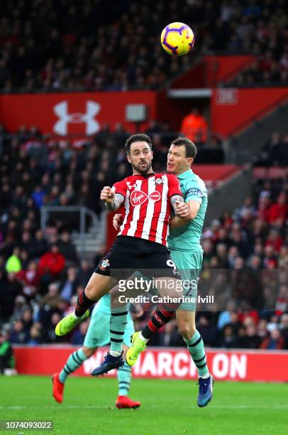 Danny Ings of Southampton scores his team's second goal under pressure from Stephan Lichtsteiner of Arsenal during the Premier League match between...