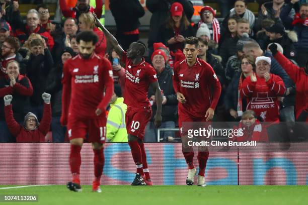 Sadio Mane of Liverpool celebrates after scoring his team's first goal during the Premier League match between Liverpool FC and Manchester United at...