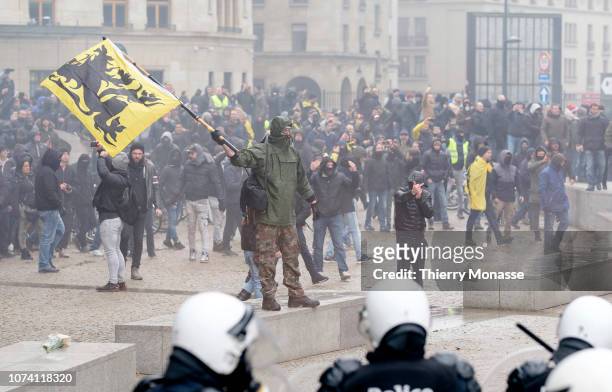 Protesters from the Extreme Right clash with police as they protest against the Marrakech agreement on migration, in the European district area on...