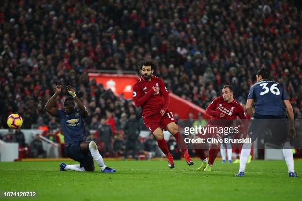 Xherdan Shaqiri of Liverpool scores his team's third goal during the Premier League match between Liverpool FC and Manchester United at Anfield on...