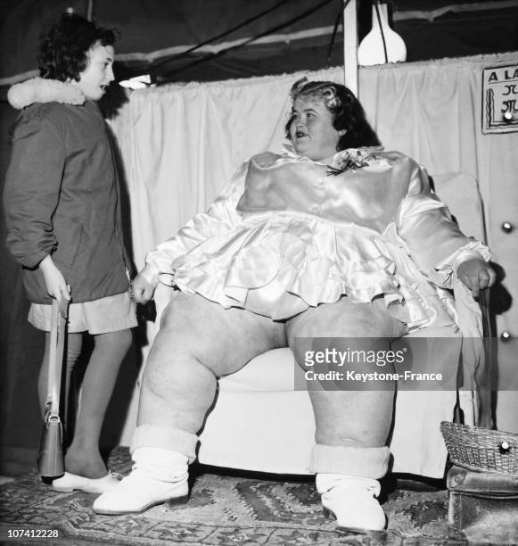 Young Girl Transfixed Before A Young Woman Weighting 207 Kilos At Foire Du Trone In Paris On March 1961