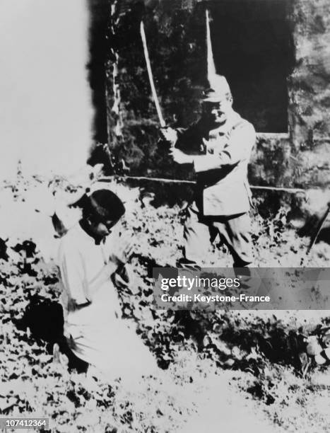 Japanese Soldier Decapitating A Young Chinese Peasant On August 1938