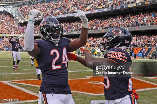 Jordan Howard and Tarik Cohen of the Chicago Bears celebrate after Howard scored a touchdown in the first quarter against the Green Bay Packers with...