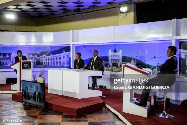 Malagasy Presidential candidate Marc Ravalomanana and Presidential candidate Andry Rajoelina get ready ahead of a public debate at the Malagasy...