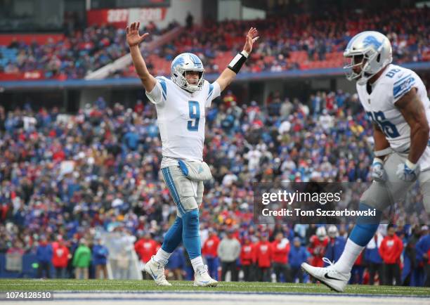 Matthew Stafford of the Detroit Lions celebrates after Zach Zenner ran the ball into the end zone for a touchdown in the second quarter during NFL...