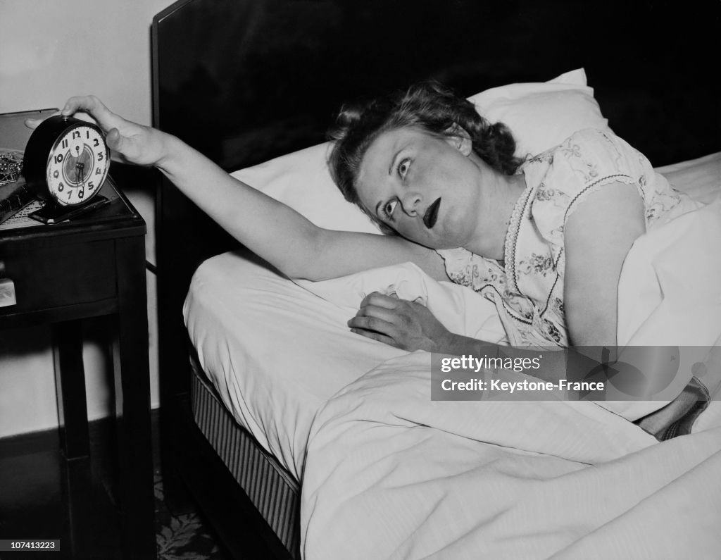 Young Girl Awaked By The Alarm Clock.
