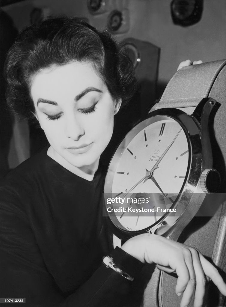 Sylvia Collins Checking The Time With The Largest And The Smallest Wrist Watch During Earls Court. British Industries Fair In London.