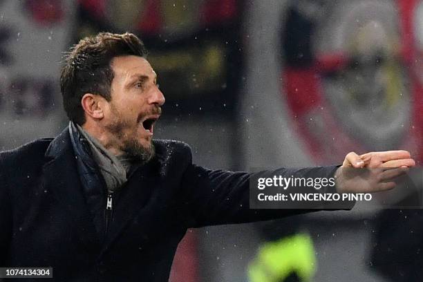 Roma Italian coach Eusebio Di Francesco gives instructions after AS Roma conceded a goal during the Italian Serie A football match AS Roma vs Genoa...