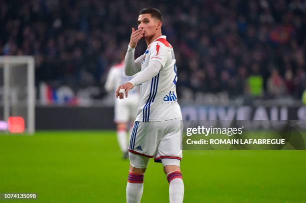 Lyon's French midfielder Houssem Aouar celebrates after scoring a goal during the French L1 football match between Lyon and Monaco on December 16 at...