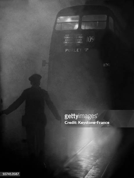 Bus Conductor Escorts His Bus Through The Thick Fog In London On December 9Th 1952