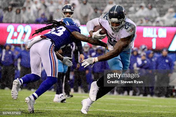 Derrick Henry of the Tennessee Titans gets past B.W. Webb of the New York Giants on his way to a second half touchdown at MetLife Stadium on December...
