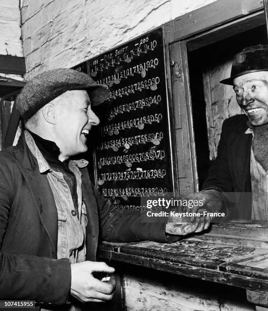 Coalmine, Miner Handing In His Tally And Check At The End Of His Shift In Great Britain