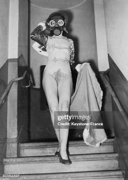 Young Music Hall Dancer Wearing A Gas Mask And Helmet On February 1940
