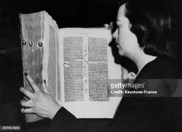 Woman Examine The First Of The Two Volumes Of The Gutenberg Bible Printed In 1455 On 1947