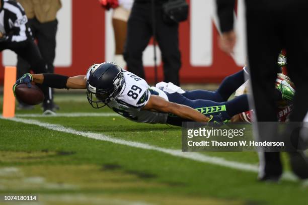 Doug Baldwin of the Seattle Seahawks dives for a touchdown against the San Francisco 49ers during their NFL game at Levi's Stadium on December 16,...