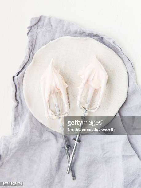 whisks covered in double cream - whipped cream stock pictures, royalty-free photos & images