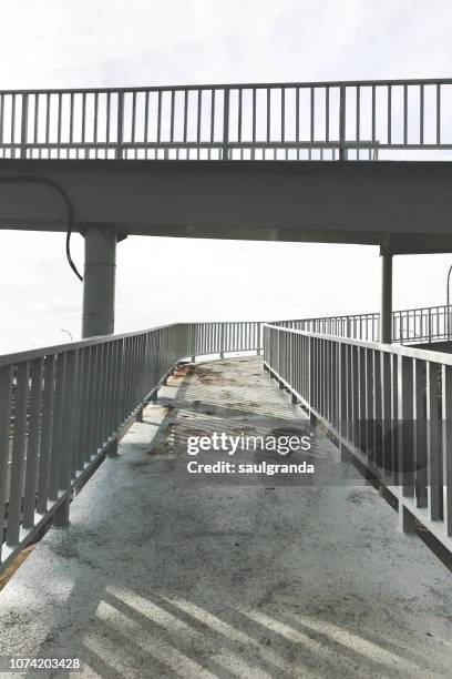 ramp on a metallic walkway - metal catwalk stock pictures, royalty-free photos & images