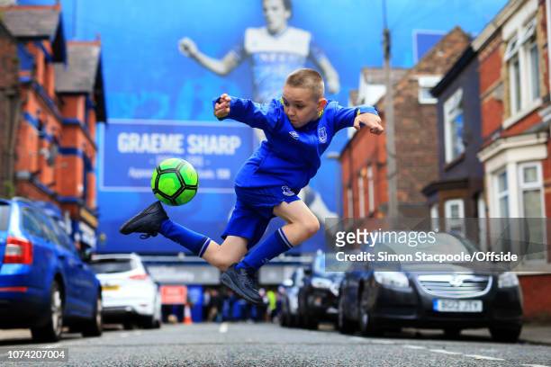12th August 2017 - Premier League - Everton v Stoke City - A young boy plays football in the streets close to Goodison Park - .